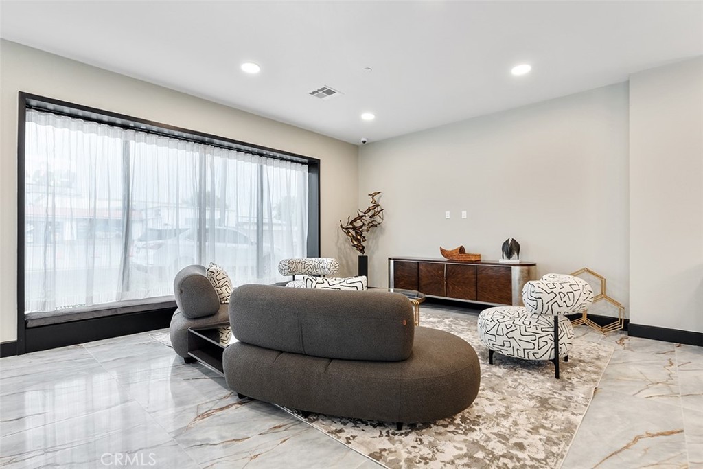 4064 Live Oak Avenue, Unit 208 Arcadia, CA 91006 - Photo 43 of 50 a living room with furniture and large windows