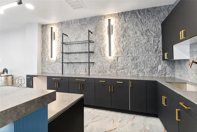 a kitchen with a sink stove and microwave