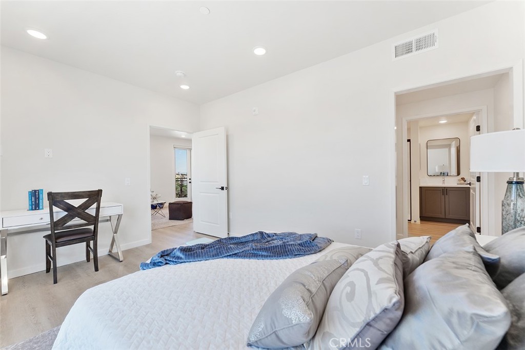 4064 Live Oak Avenue, Unit 208 Arcadia, CA 91006 - Photo 10 of 50 a bedroom with a bed and a chair