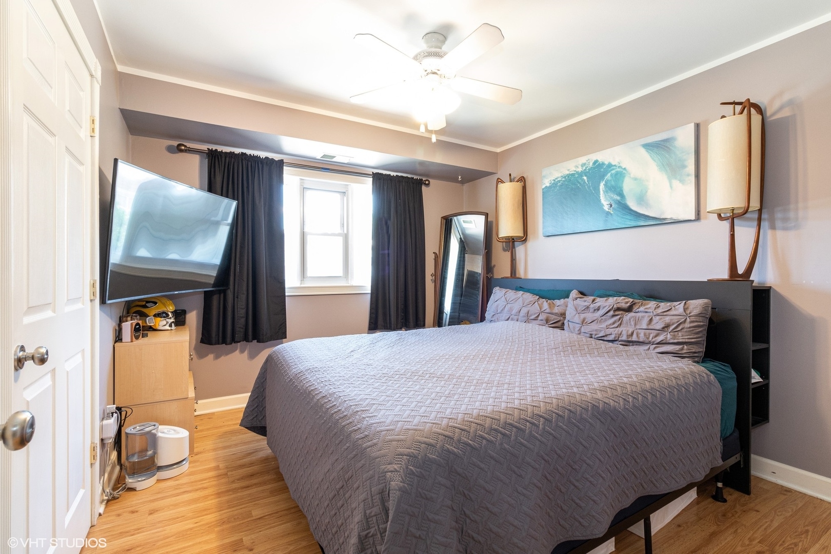 7033 Mather Avenue, Unit 2A Chicago Ridge, IL 60415 - Photo 6 of 10 a bedroom with a large bed and a chandelier