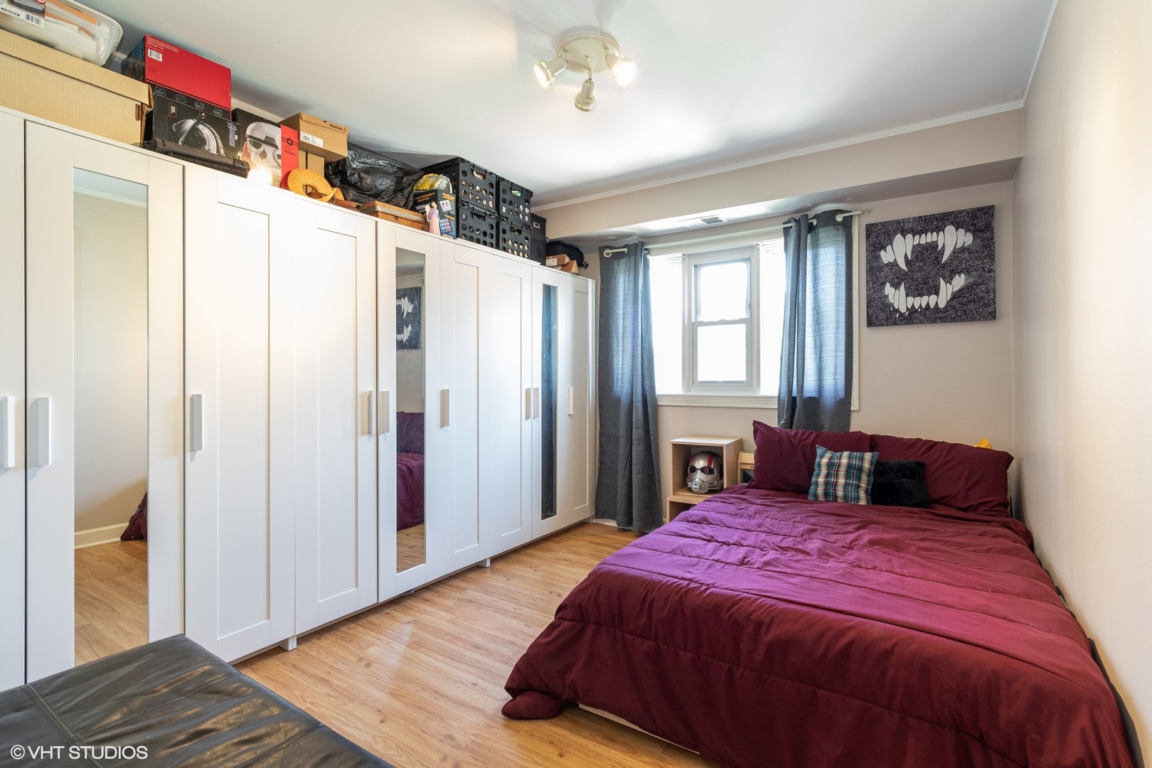 7033 Mather Avenue, Unit 2A Chicago Ridge, IL 60415 - Photo 7 of 10 a bedroom with a large bed and a window