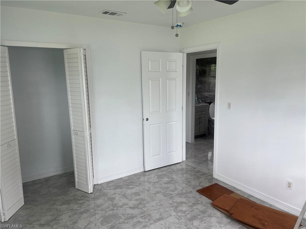 160 Brooks Road North Fort Myers, FL 33917 - Photo 14 of 19 an empty room with windows and closet