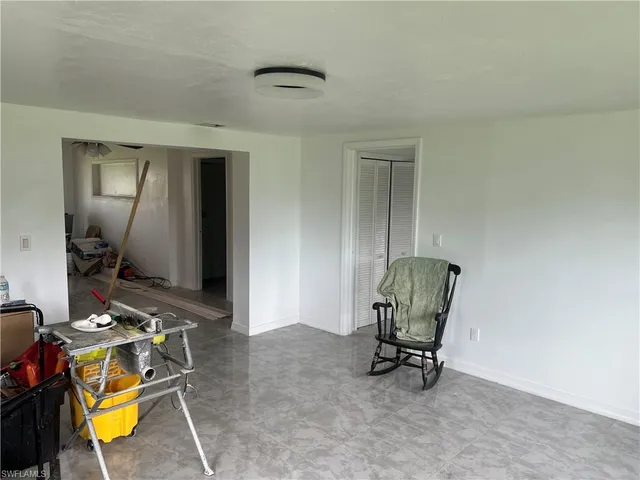 a room with furniture and gym equipment