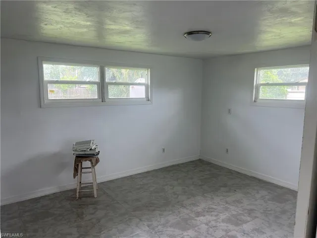 a view of an empty room and window