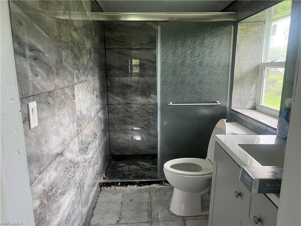160 Brooks Road North Fort Myers, FL 33917 - Photo 10 of 19 a bathroom with a toilet and a shower