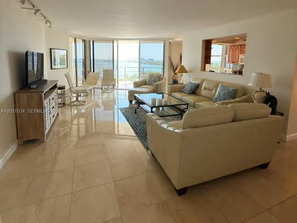 a living room with fireplace furniture and a flat screen tv