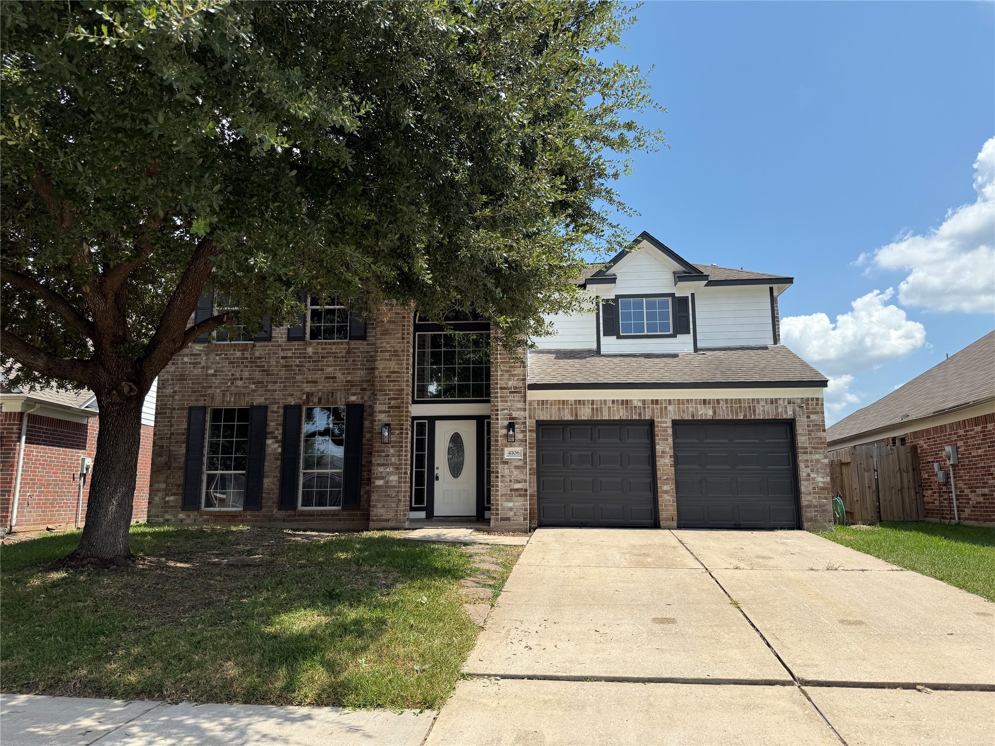 4106 Forest Rain Lane Atascocita, TX 77346 - Photo 1 of 49 a front view of a house with a garden