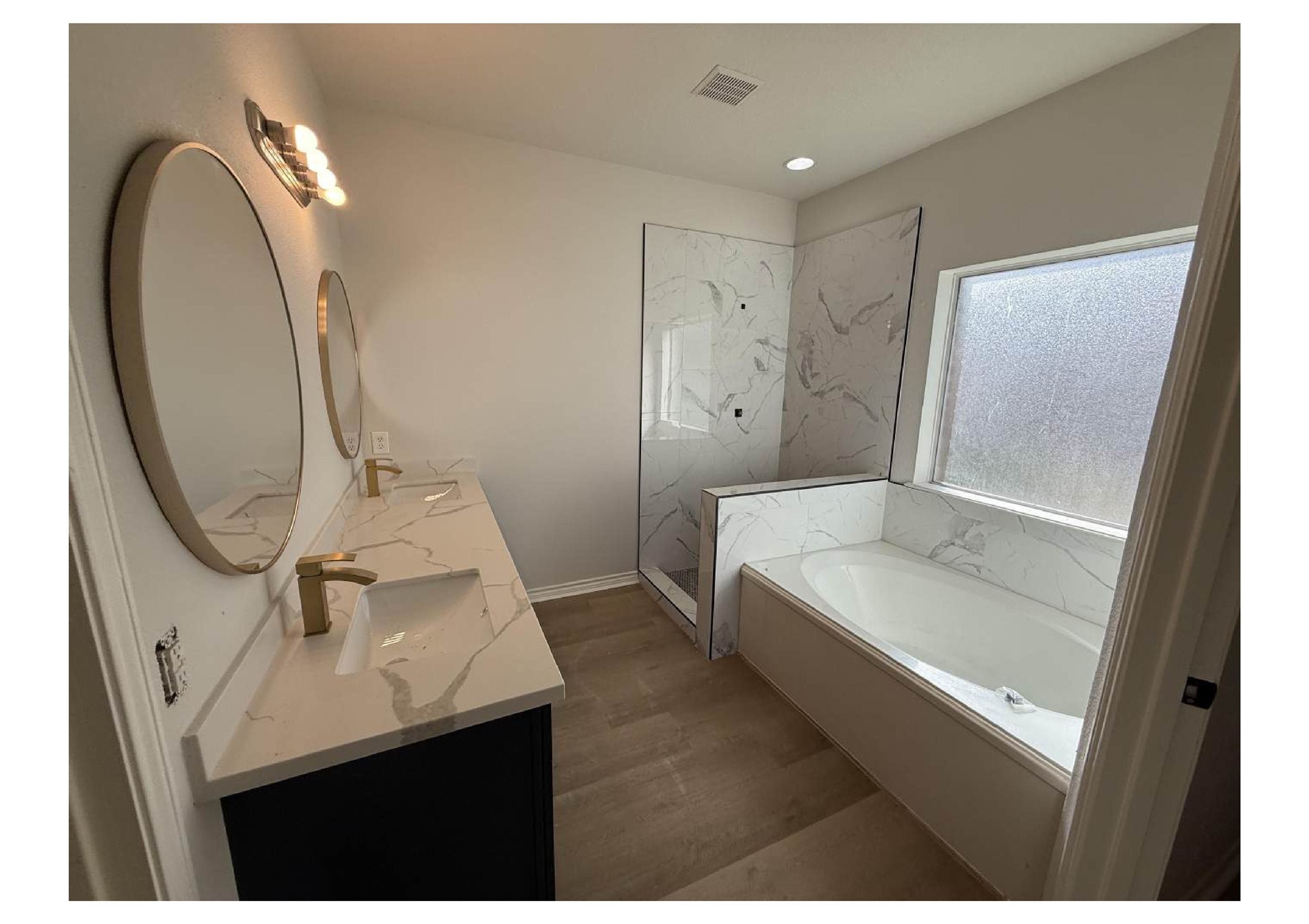 4106 Forest Rain Lane Atascocita, TX 77346 - Photo 13 of 49 a bathroom with a sink a toilet and a mirror