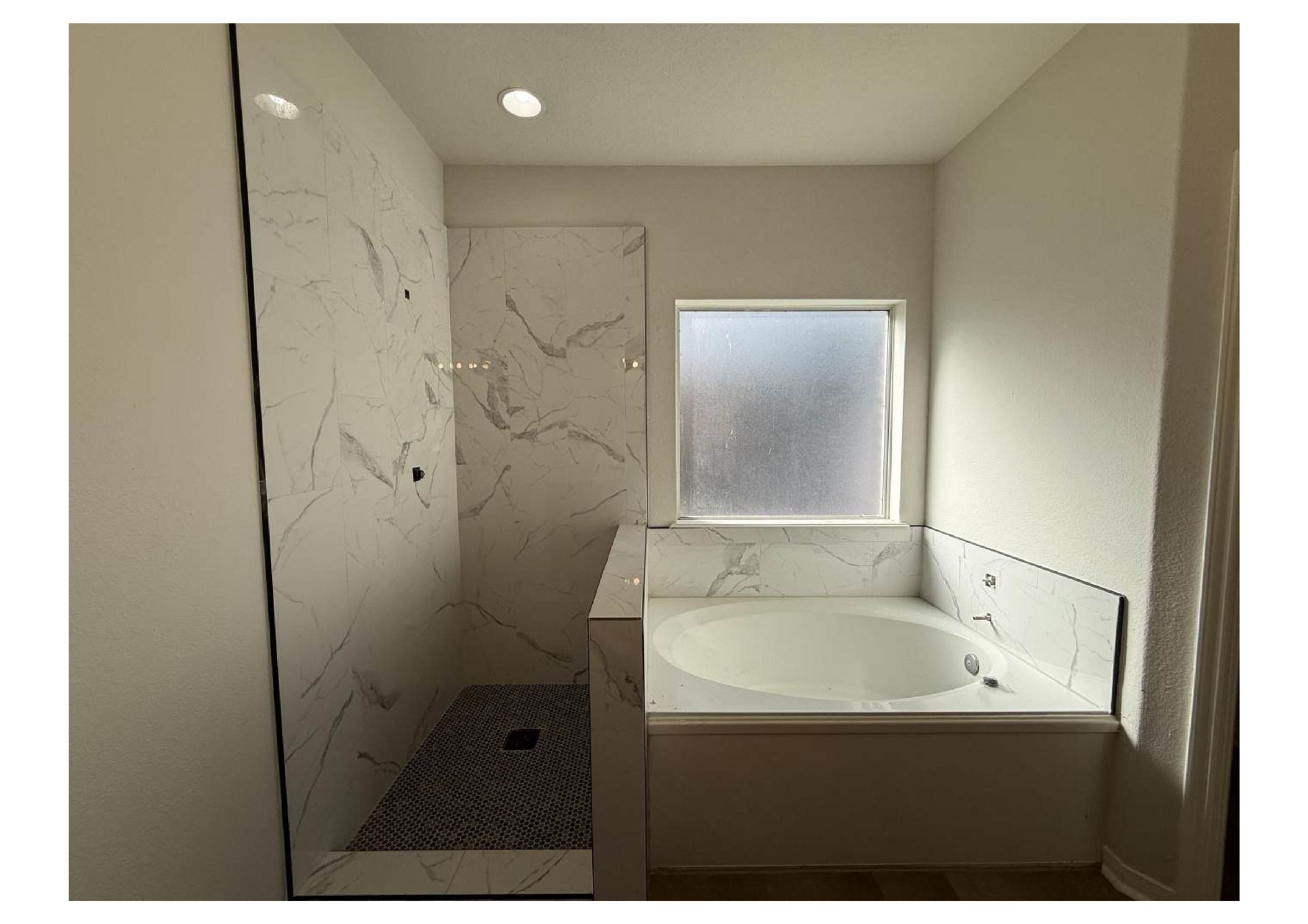 4106 Forest Rain Lane Atascocita, TX 77346 - Photo 14 of 49 a bathroom with a bathtub and shower