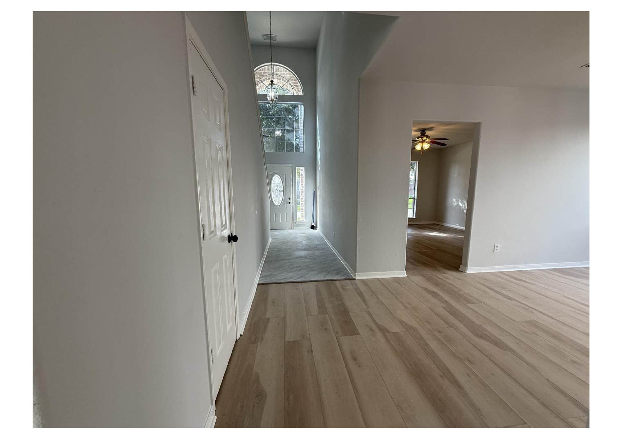 4106 Forest Rain Lane Atascocita, TX 77346 - Photo 16 of 49 a view of a room with wooden floor and entryway