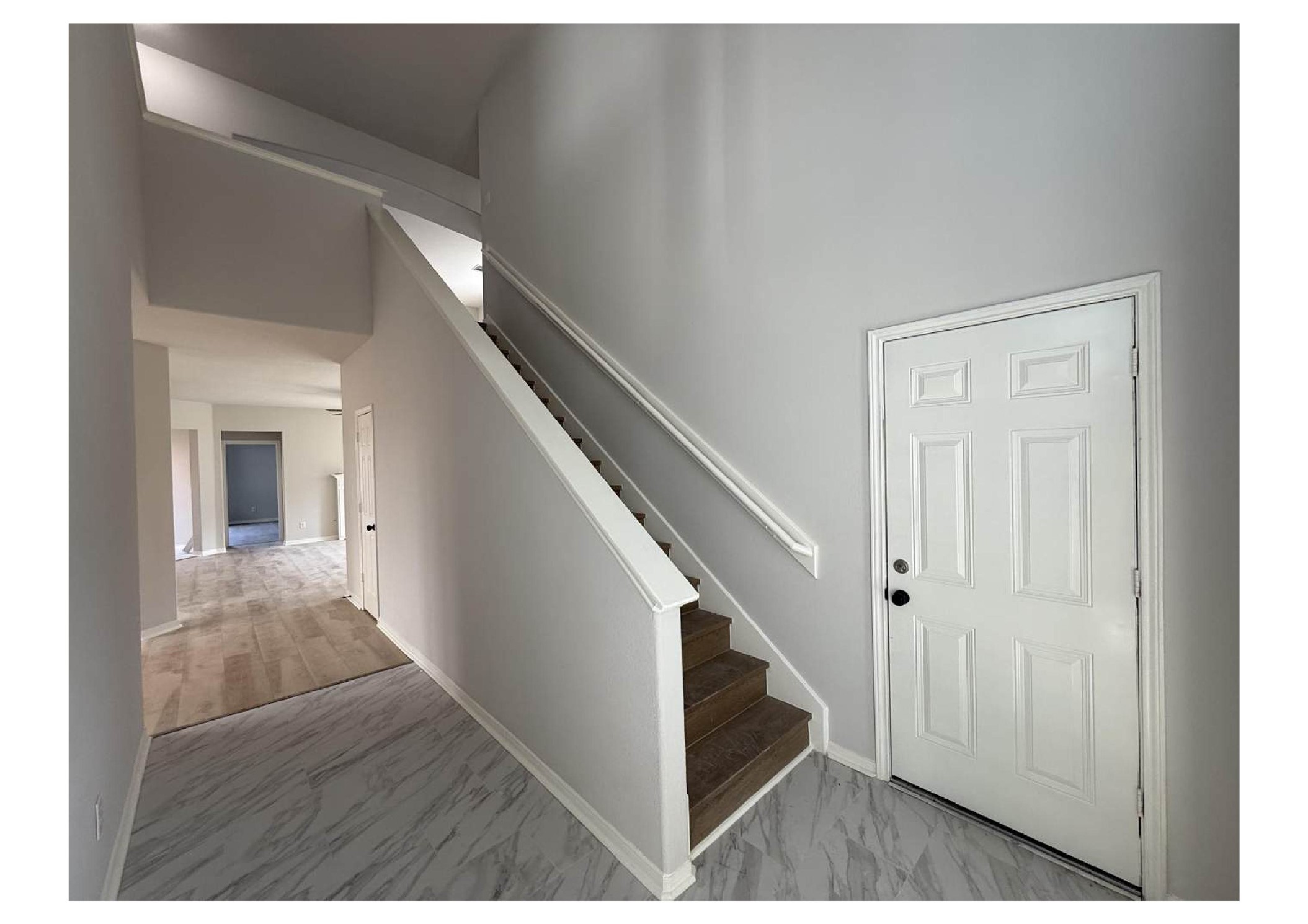 4106 Forest Rain Lane Atascocita, TX 77346 - Photo 18 of 49 a view of a hallway with wooden floor and staircase