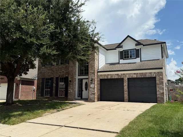 a front view of a house with yard