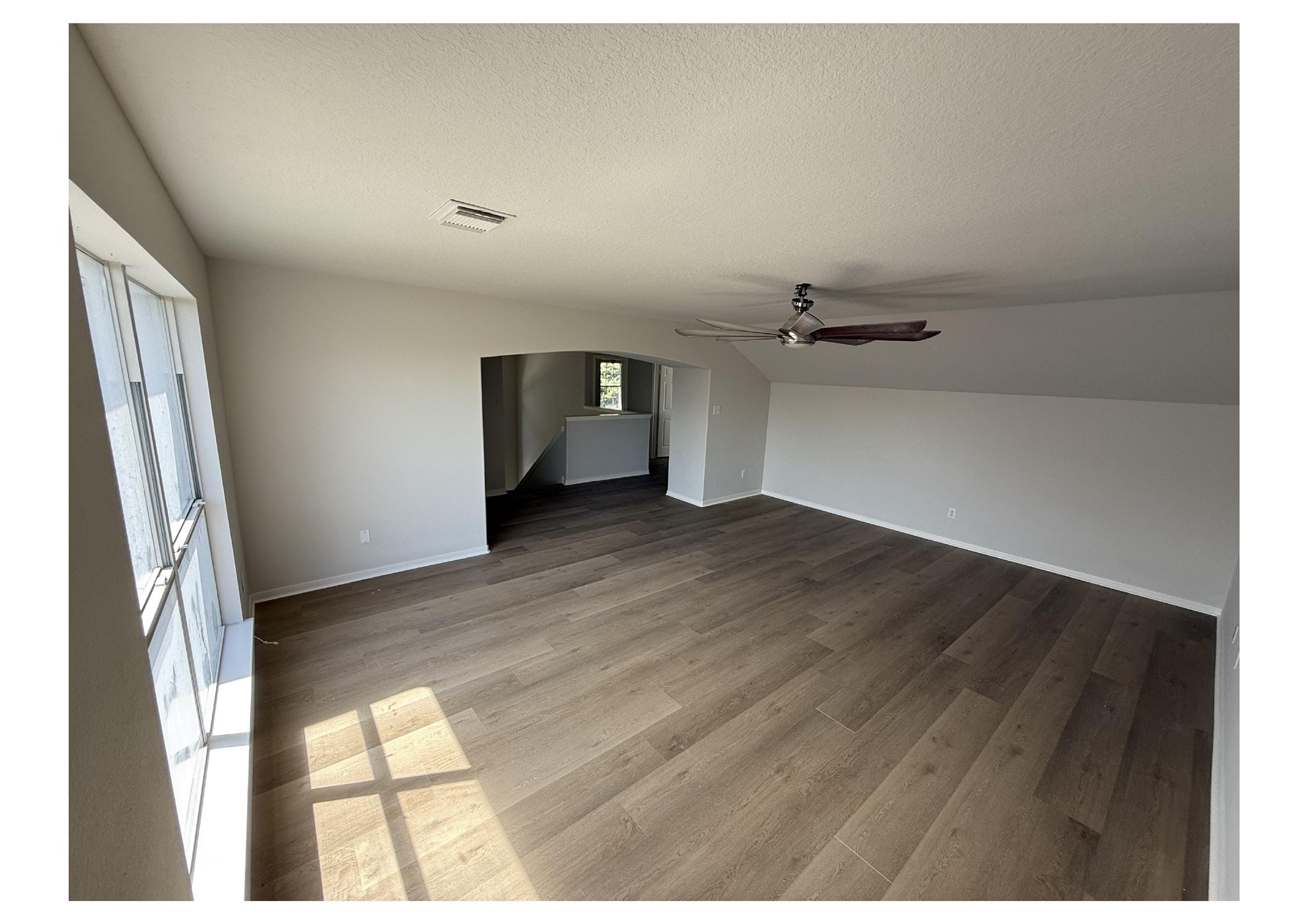 4106 Forest Rain Lane Atascocita, TX 77346 - Photo 38 of 49 a view of empty room with wooden floor and fan