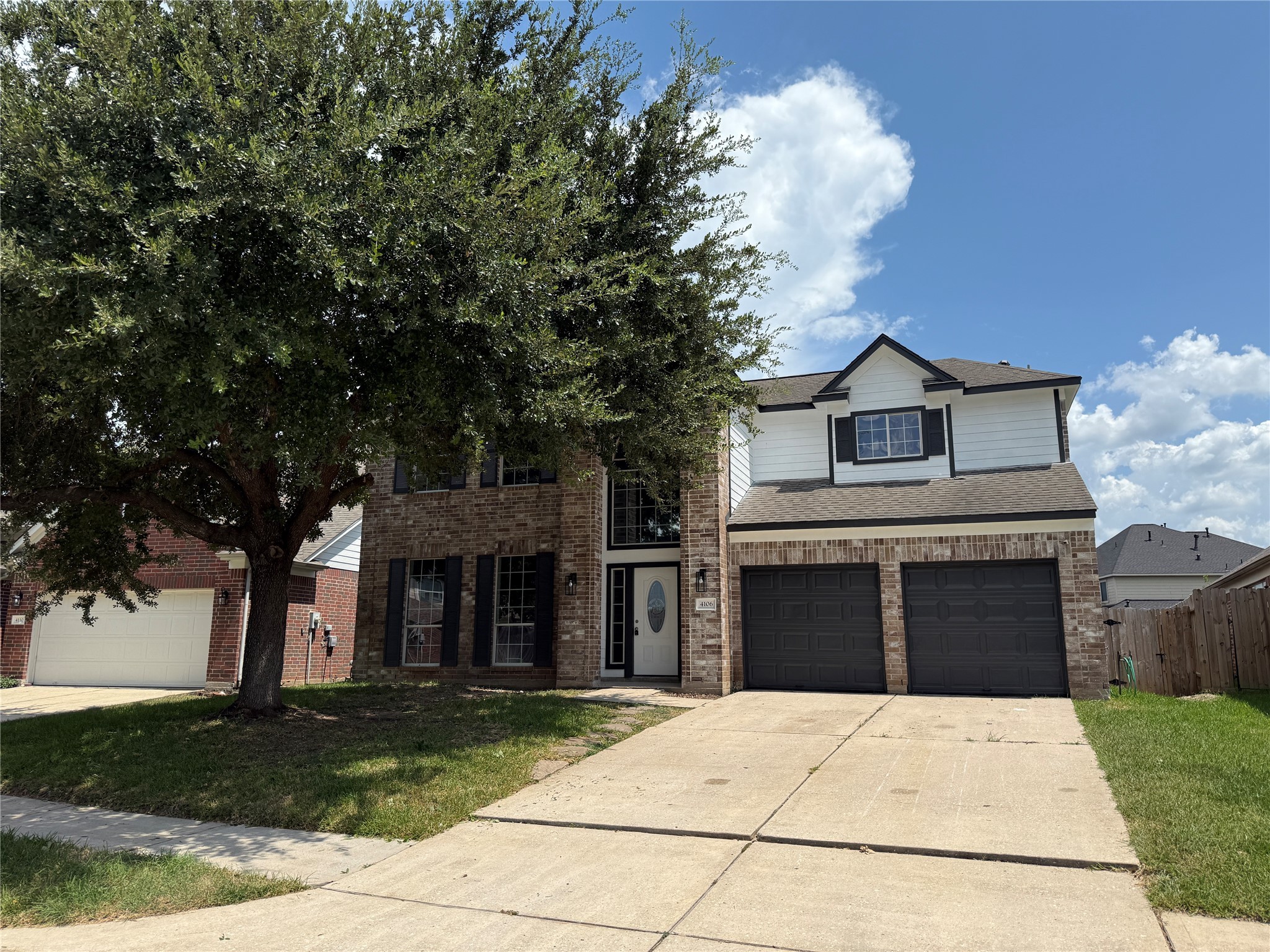 4106 Forest Rain Lane Atascocita, TX 77346 - Photo 4 of 49 a front view of a house with a yard and garage