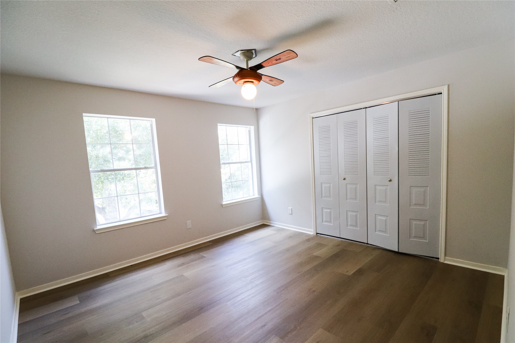 4106 Forest Rain Lane Atascocita, TX 77346 - Photo 42 of 49 wooden floor in an empty room with a window