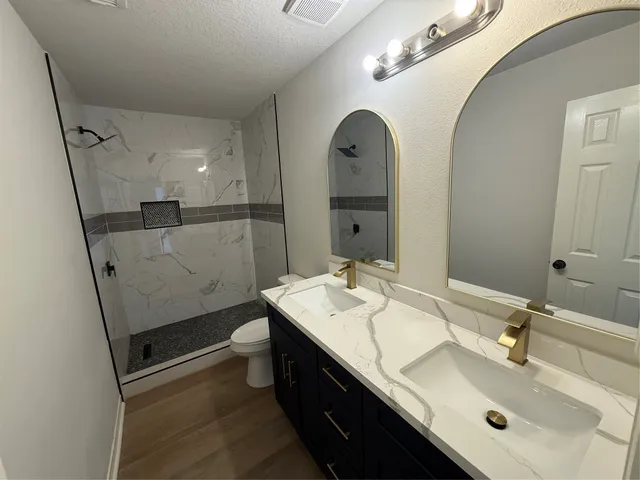 a bathroom with a sink a vanity and a mirror