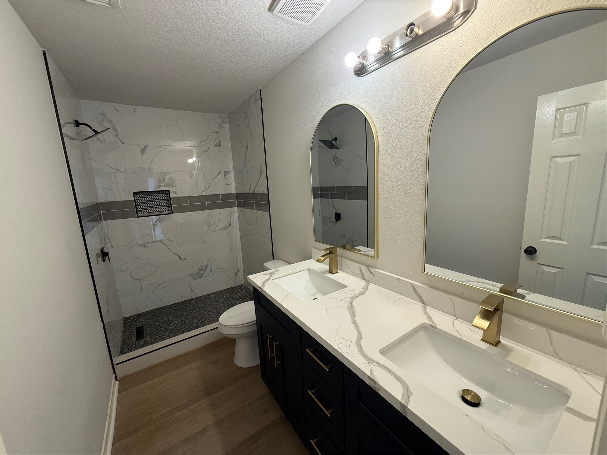 4106 Forest Rain Lane Atascocita, TX 77346 - Photo 43 of 49 a bathroom with a sink a vanity and a mirror