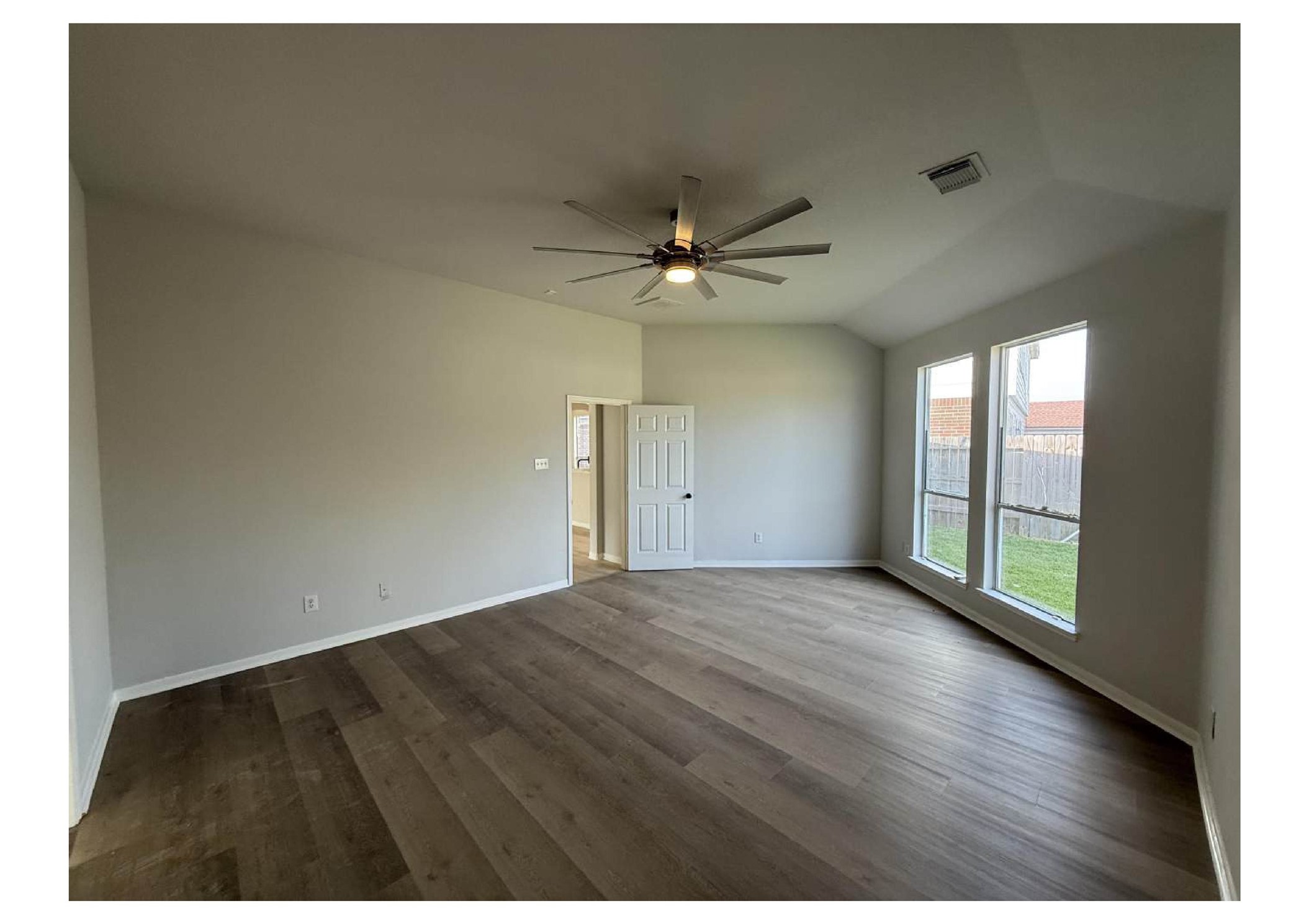 4106 Forest Rain Lane Atascocita, TX 77346 - Photo 7 of 49 an empty room with wooden floor and fan