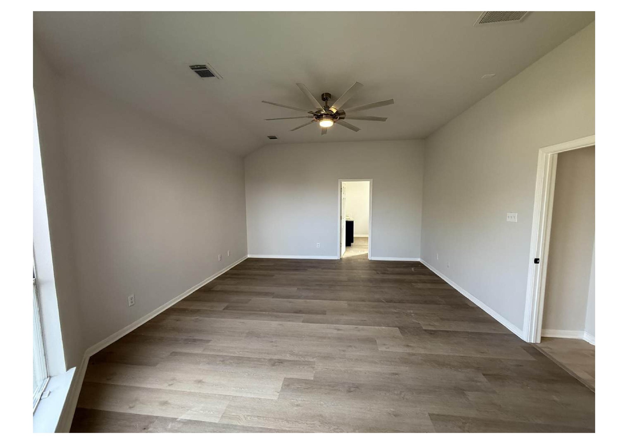 4106 Forest Rain Lane Atascocita, TX 77346 - Photo 8 of 49 a view of empty room with wooden floor