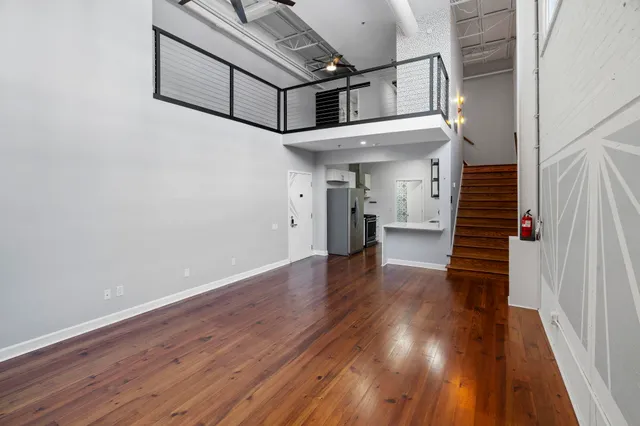 a view of an entryway with wooden floor