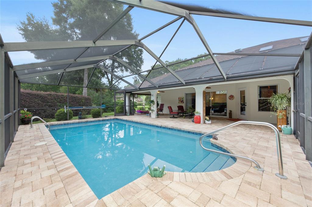 18825 Southwest 93rd Loop Dunnellon, FL 34432 - Photo 57 of 85 a view of a swimming pool with a patio