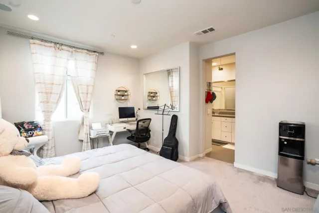 a bedroom with a bed and furniture