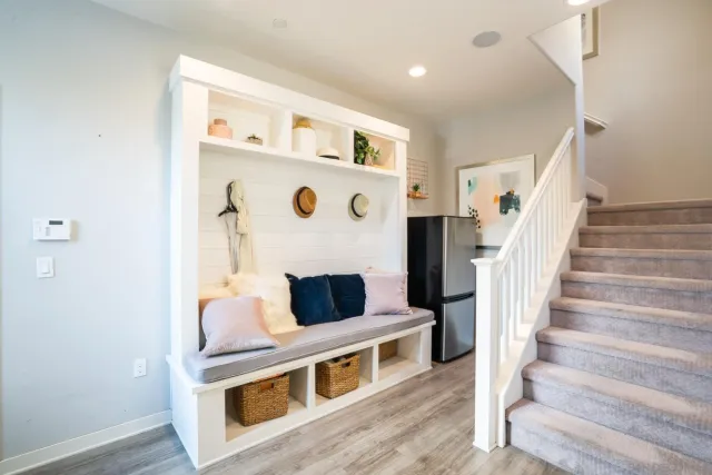 a view of living room with furniture and a fireplace