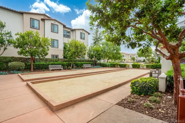 a view of a house with a yard and plants