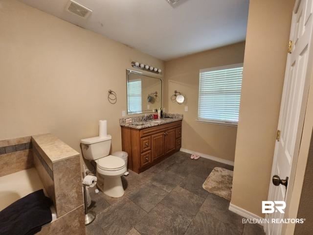 32749 Antietam Road Lillian, AL 36549 - Photo 11 of 47 Bathroom featuring vanity and toilet