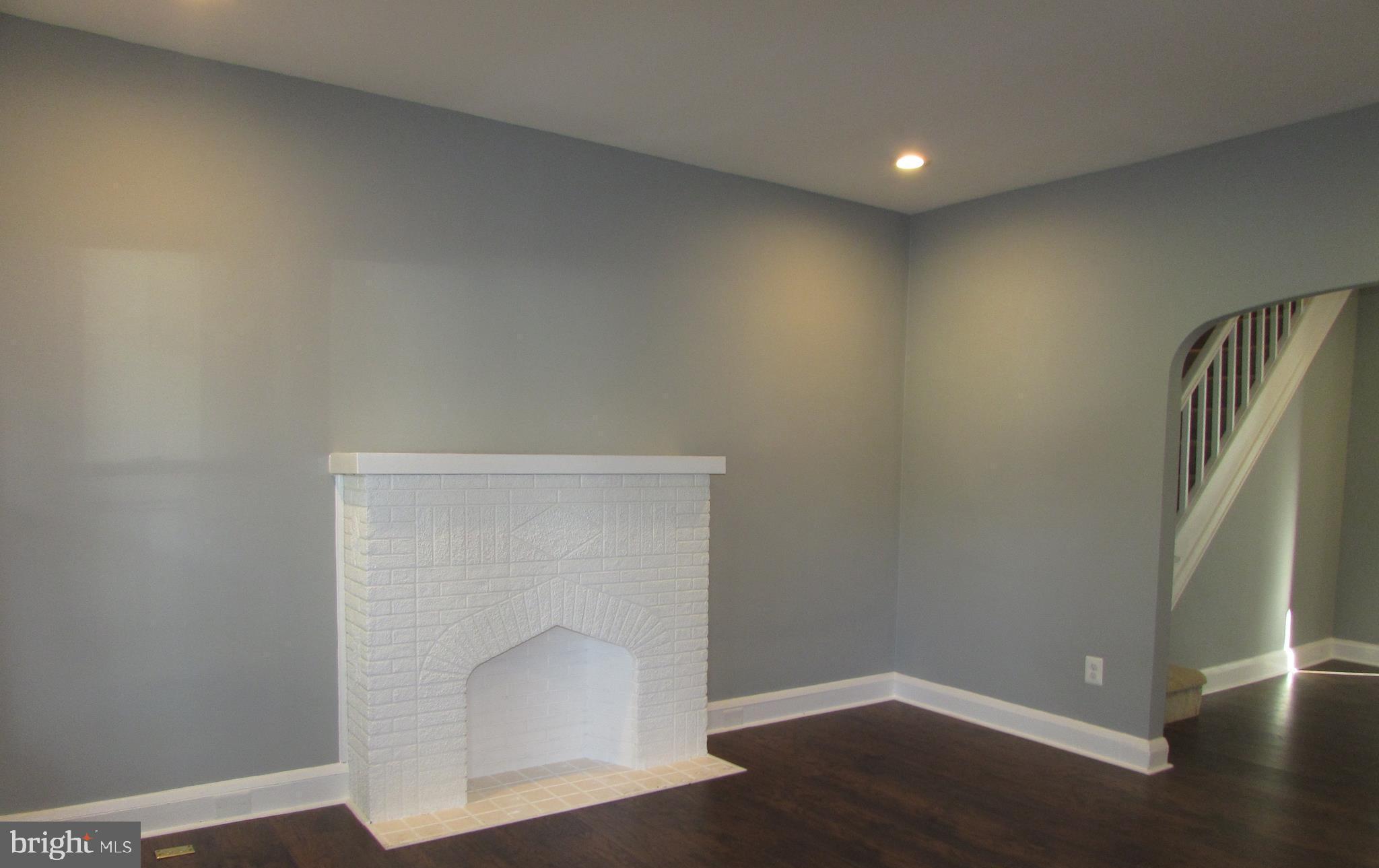 2735 Chesterfield Avenue Baltimore, MD 21213 - Photo 11 of 30 FULL LIVING ROOM, DECORATIVE FIREPLACE, BAY WINDOW