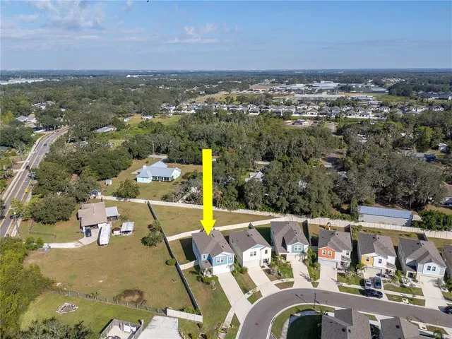 an aerial view of a house with a ocean view