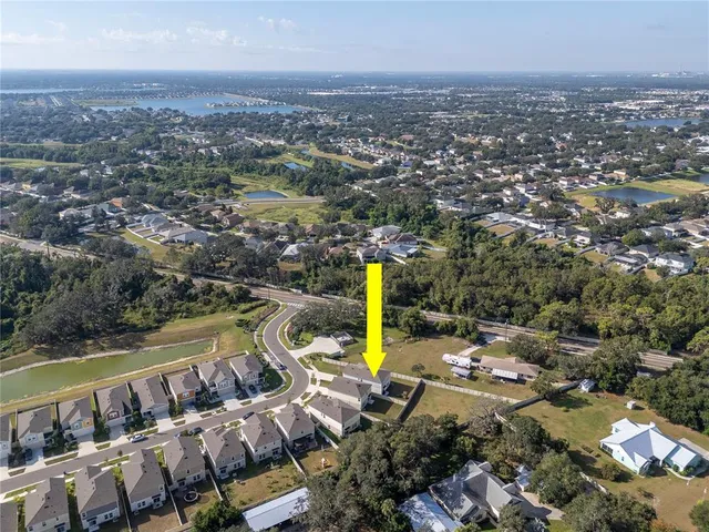 an aerial view of a house with a swimming pool