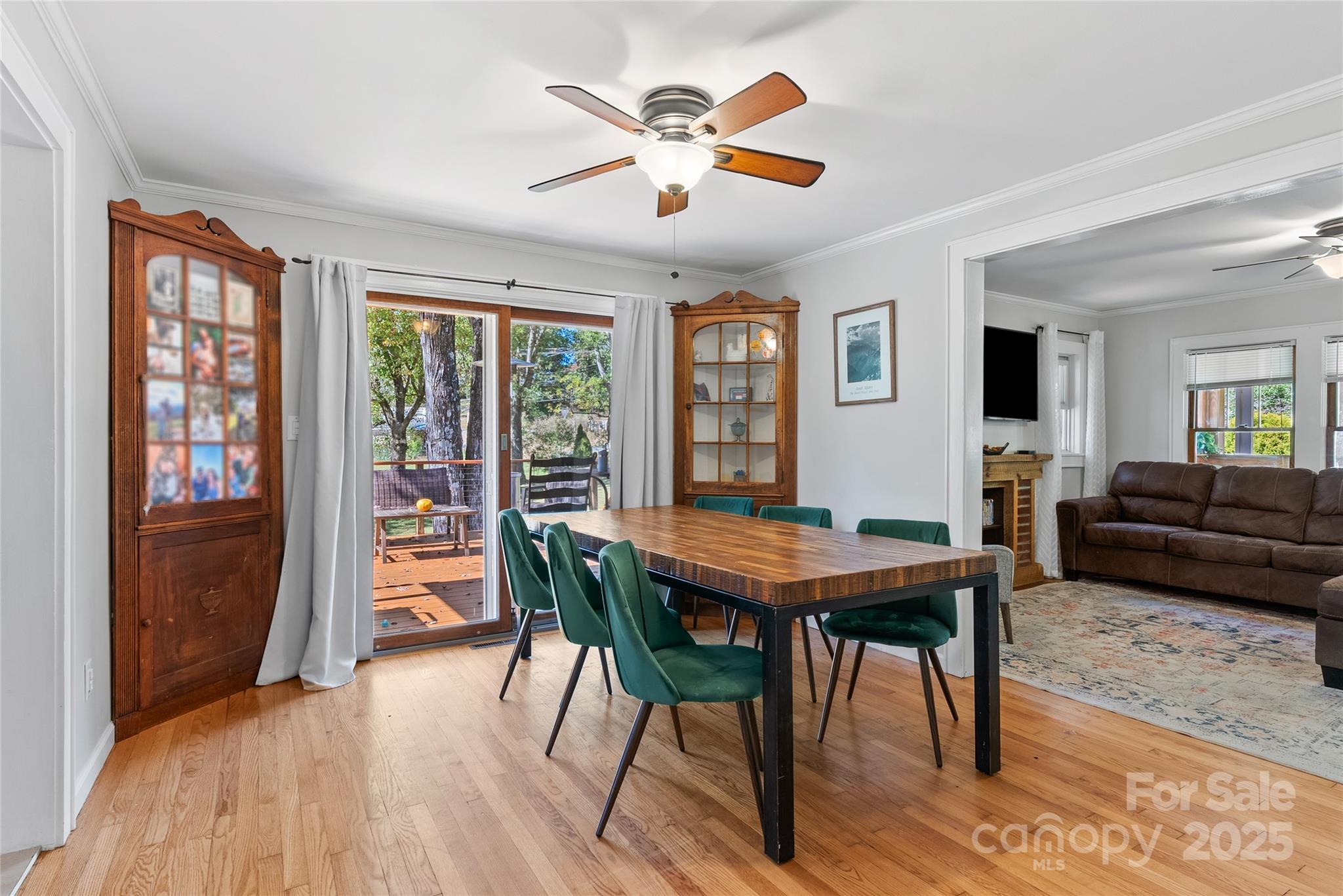 175 Candler School Road Candler, NC 28715 - Photo 11 of 37 a view of a dining room with furniture window and wooden floor