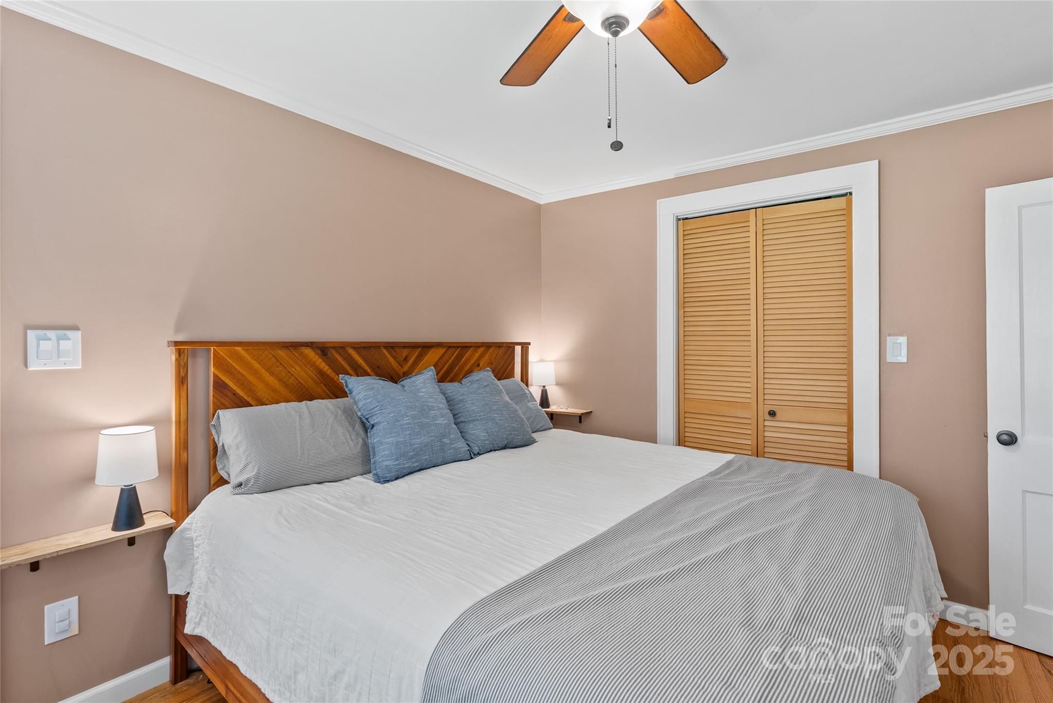 175 Candler School Road Candler, NC 28715 - Photo 18 of 37 a bedroom with a bed and a window