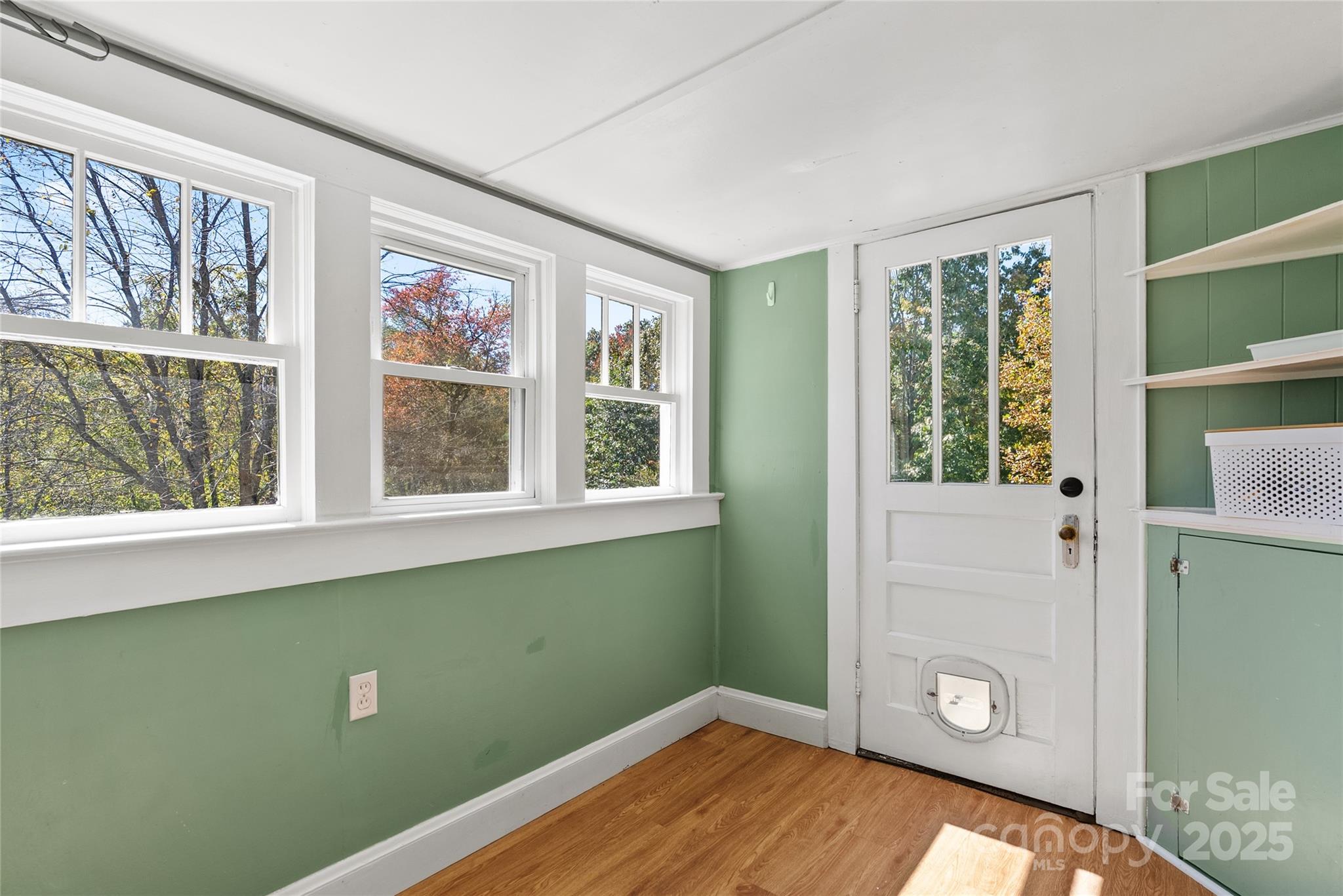 175 Candler School Road Candler, NC 28715 - Photo 25 of 37 a view of a livingroom with wooden floor and a window
