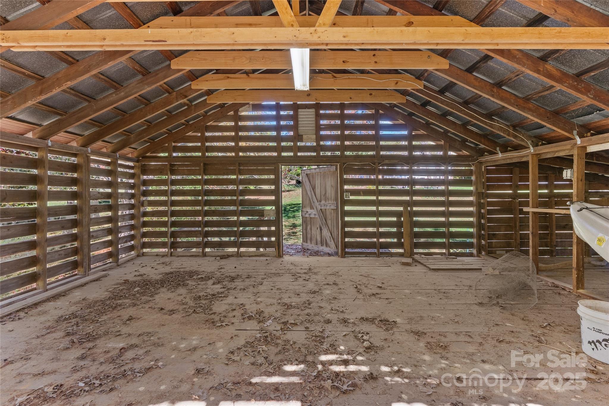 175 Candler School Road Candler, NC 28715 - Photo 31 of 37 a view of an empty room with a brick wall