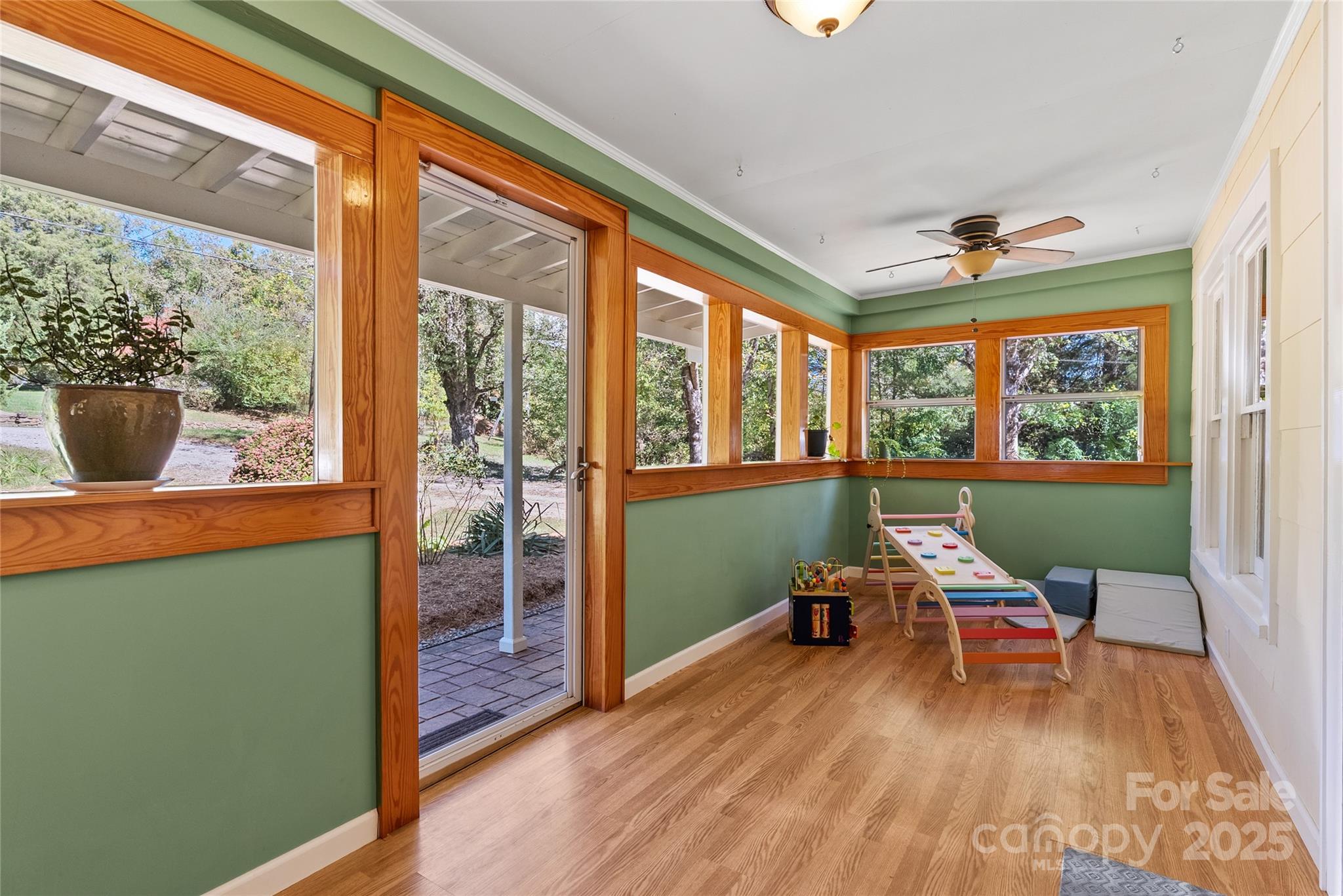 175 Candler School Road Candler, NC 28715 - Photo 6 of 37 a work room with wooden floor and a window