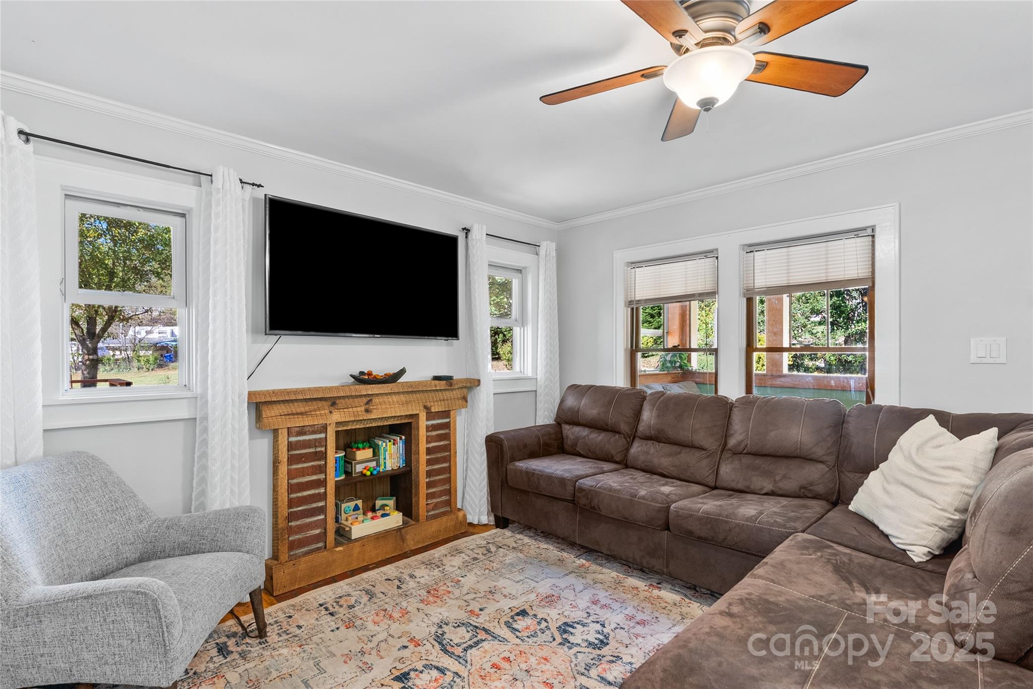 175 Candler School Road Candler, NC 28715 - Photo 7 of 37 a living room with furniture and a flat screen tv