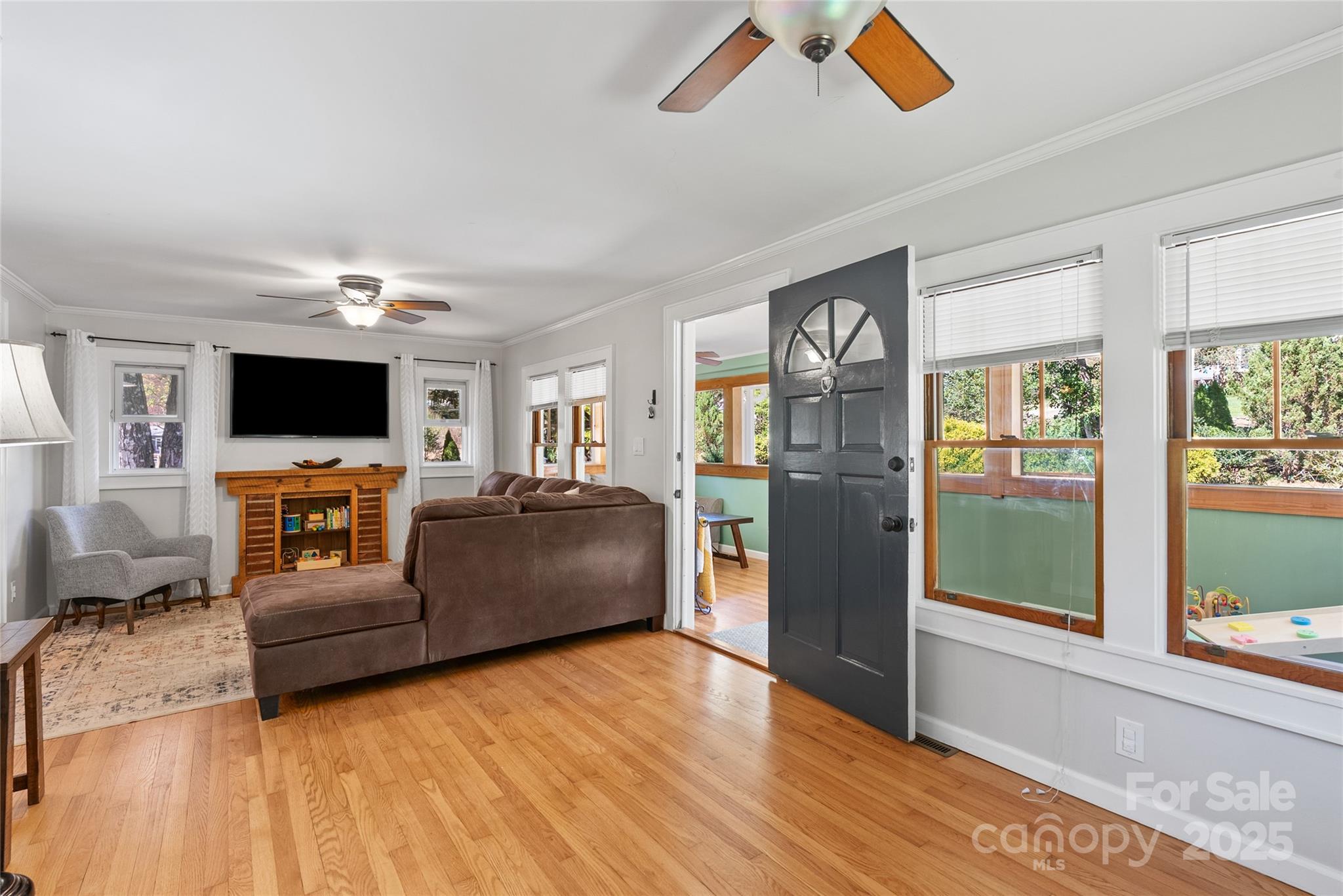 175 Candler School Road Candler, NC 28715 - Photo 10 of 37 a living room with furniture and a flat screen tv
