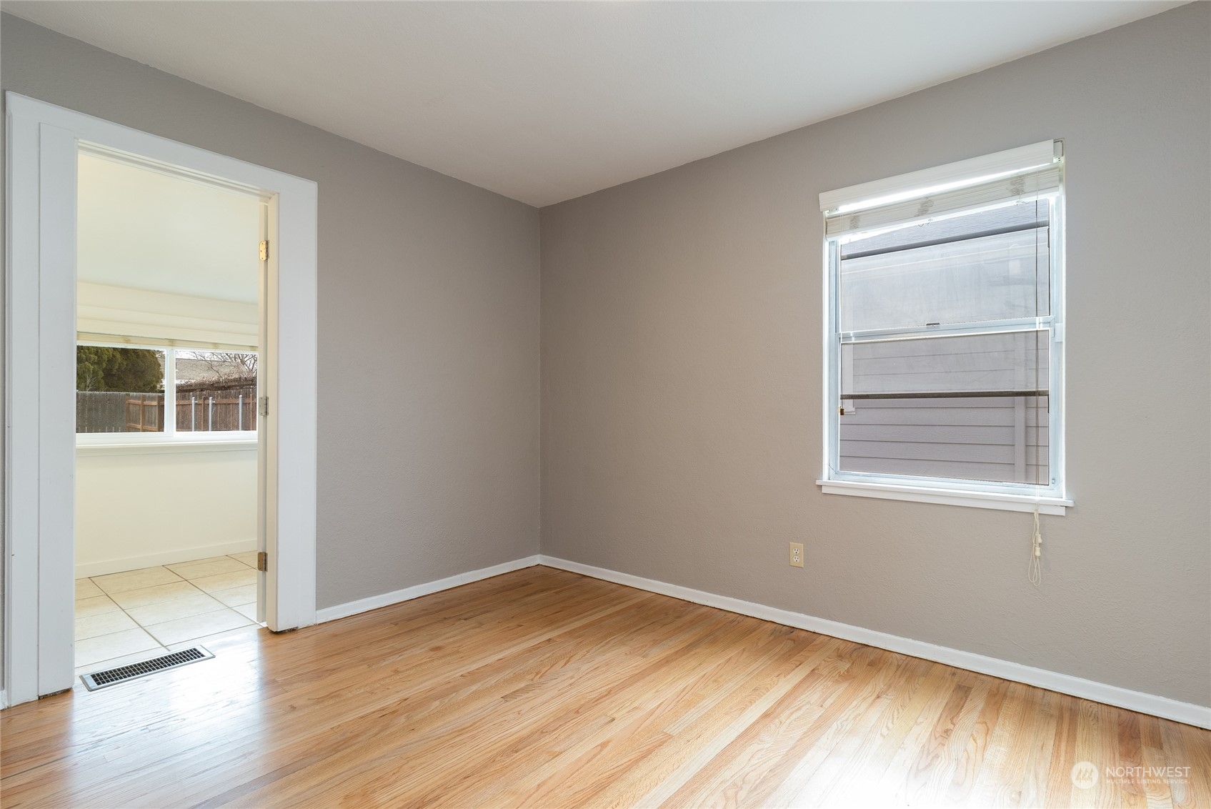 1055 St John Walla Walla, WA 99362 - Photo 12 of 27 an empty room with wooden floor and windows
