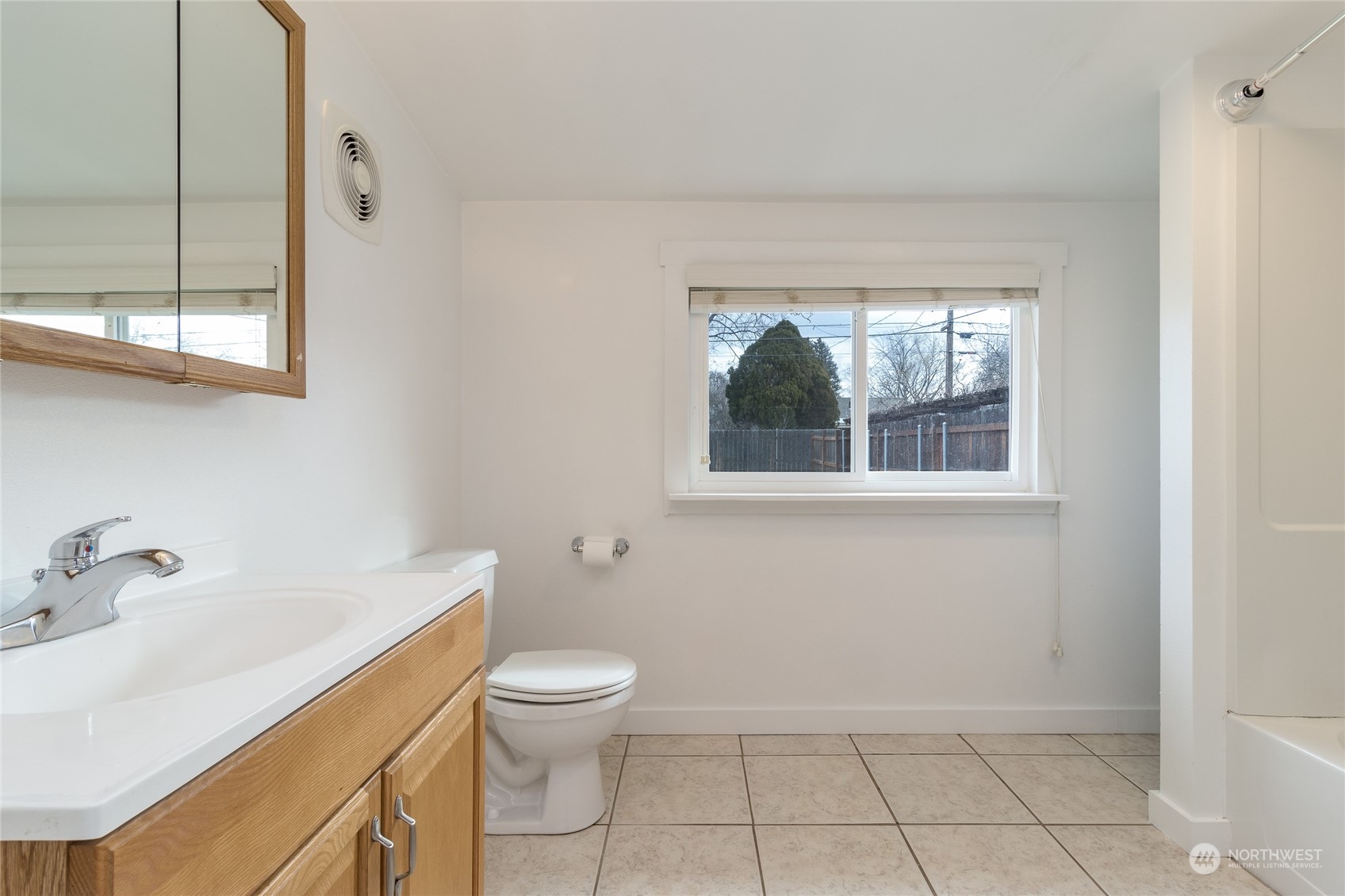 1055 St John Walla Walla, WA 99362 - Photo 16 of 27 a bathroom with a toilet sink and window