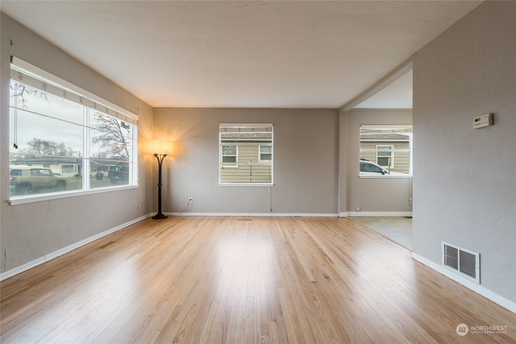 1055 St John Walla Walla, WA 99362 - Photo 4 of 27 a view of an empty room with wooden floor and a window