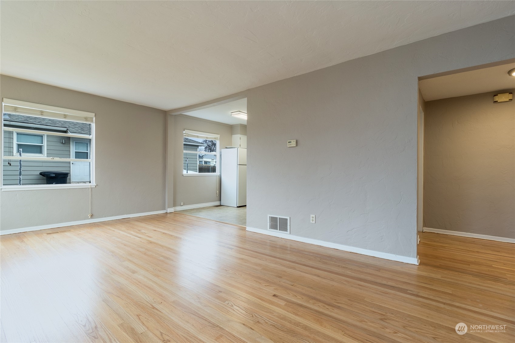 1055 St John Walla Walla, WA 99362 - Photo 5 of 27 a view of an empty room with window and wooden floor