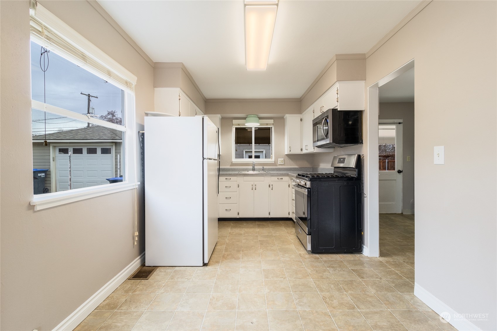1055 St John Walla Walla, WA 99362 - Photo 6 of 27 a view of kitchen with stainless steel appliances granite countertop a refrigerator and a stove top oven