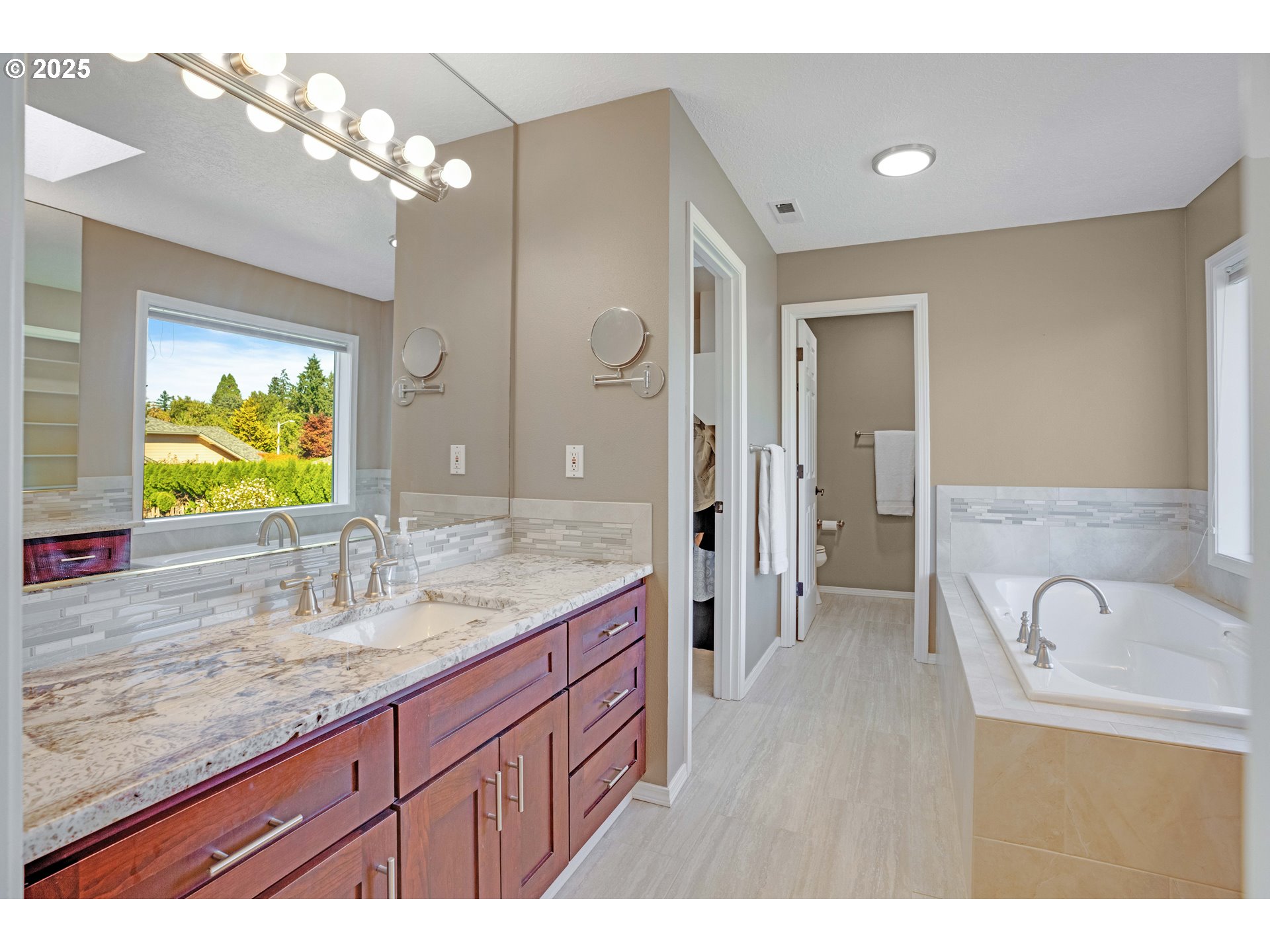 20194 Canyon Ridge Drive Oregon City, OR 97045 - Photo 16 of 41 a bathroom with a granite countertop sink mirror and vanity