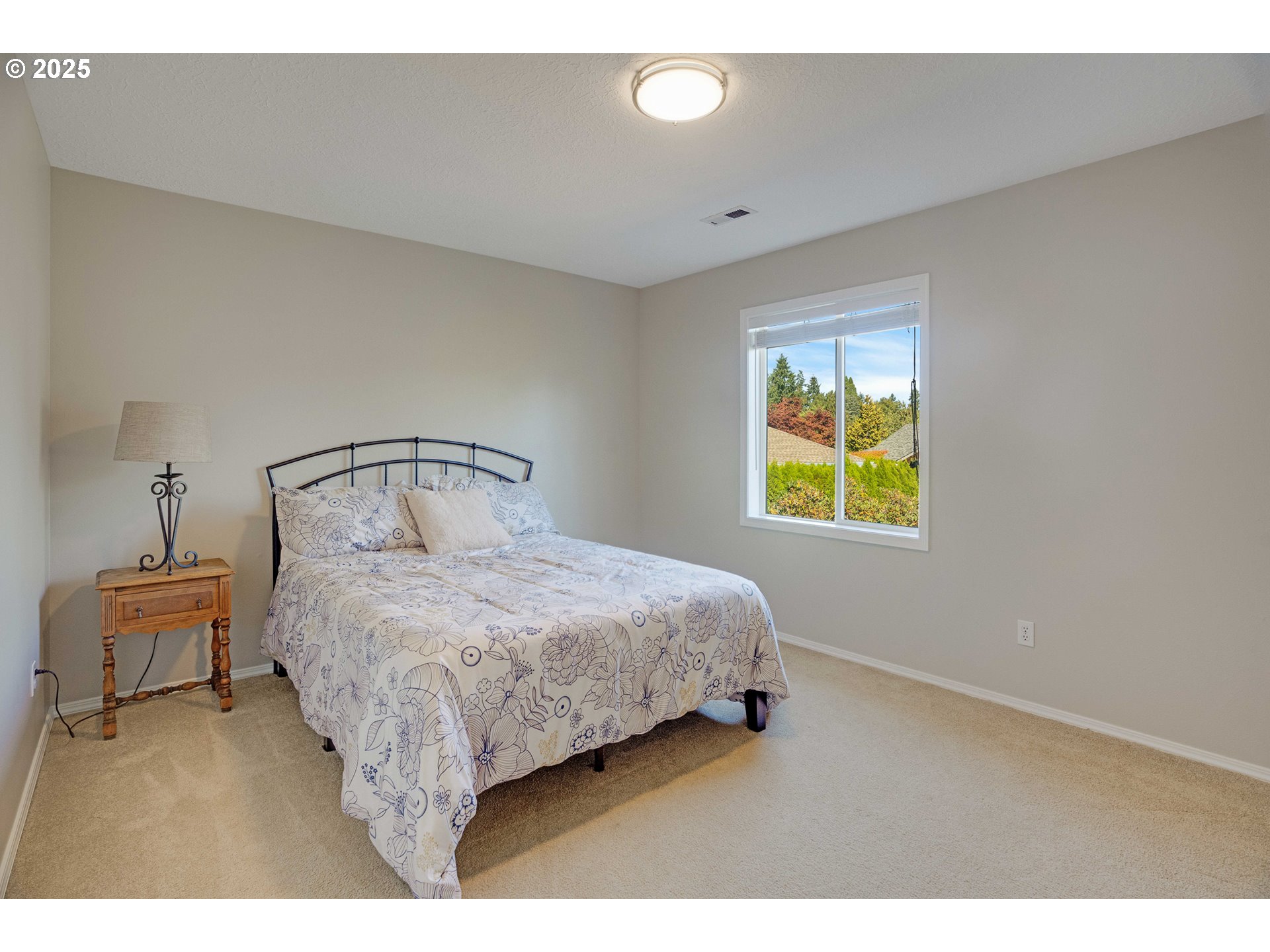 20194 Canyon Ridge Drive Oregon City, OR 97045 - Photo 20 of 41 a bedroom with a bed and a painting on the wall