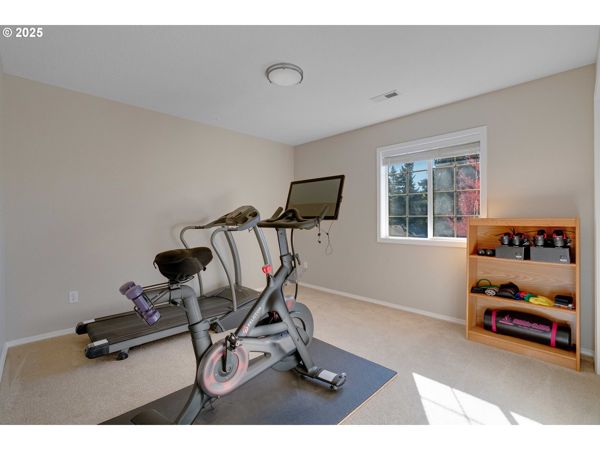 20194 Canyon Ridge Drive Oregon City, OR 97045 - Photo 26 of 41 a room with gym equipment and view of living room