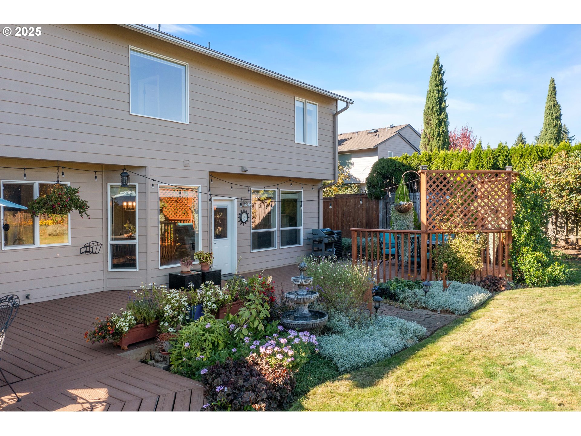20194 Canyon Ridge Drive Oregon City, OR 97045 - Photo 34 of 41 a view of a house with brick walls and flower plants