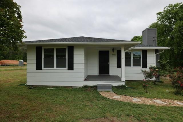 4006 North Arnold Mill Road Woodstock, GA 30188 - Photo 1 of 18 a front view of a house with a yard