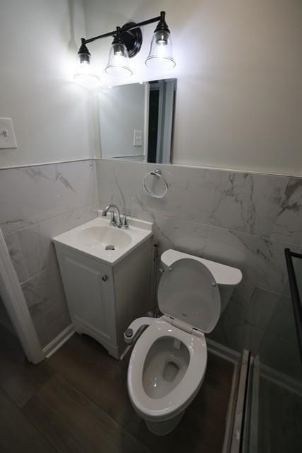 4006 North Arnold Mill Road Woodstock, GA 30188 - Photo 11 of 18 a bathroom with a toilet sink and mirror